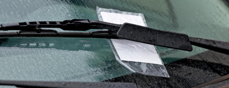 Fine on car windscreen underneath a windscreen wiper